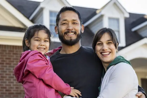 Family in front of a house