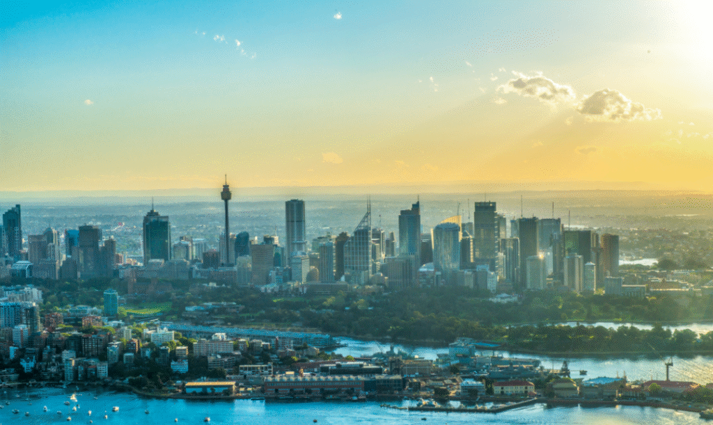 Sydney skyline at sunset, highlighting the real estate landscape in New South Wales.